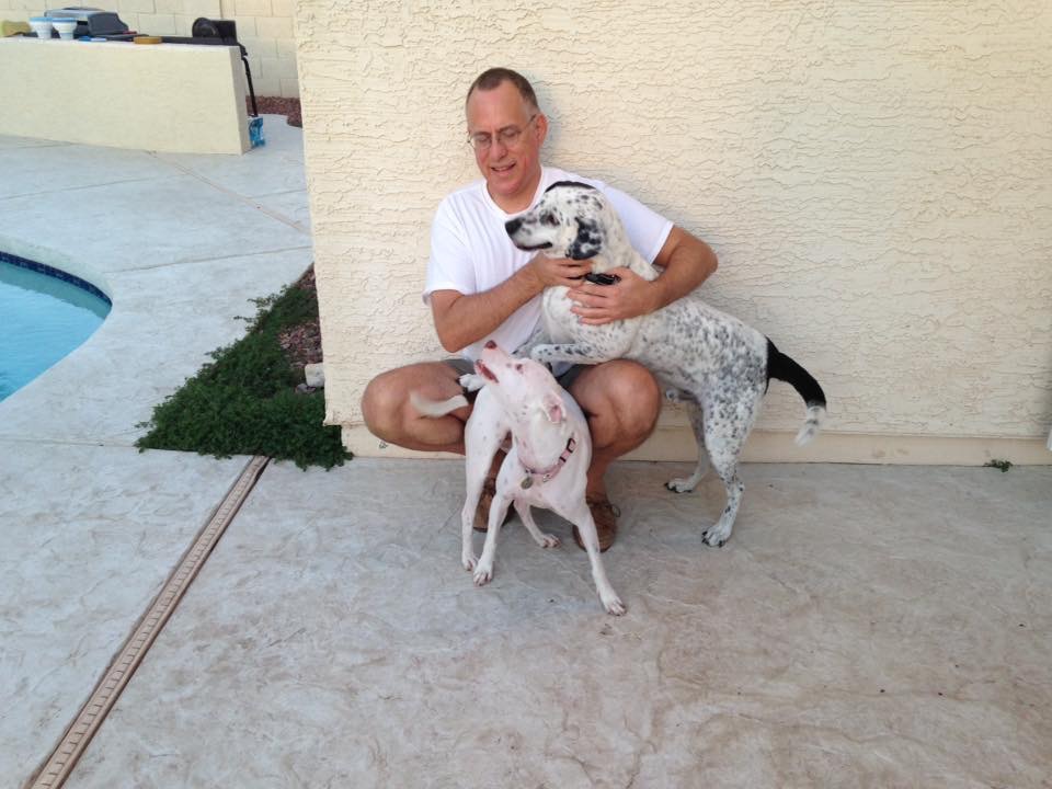 Chuck and two of the dogs on the back deck